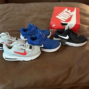 4 Pairs of Toddler Size 10 Sneakers Nike and Under Armour.